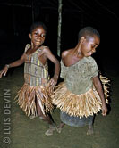 Young Pygmy girls dancing a participation dance