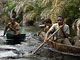 Net fishing on a pirogue (Baka Pygmies, Gabon)