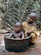 Bambino in pentola (Pigmei Baka, Camerun)